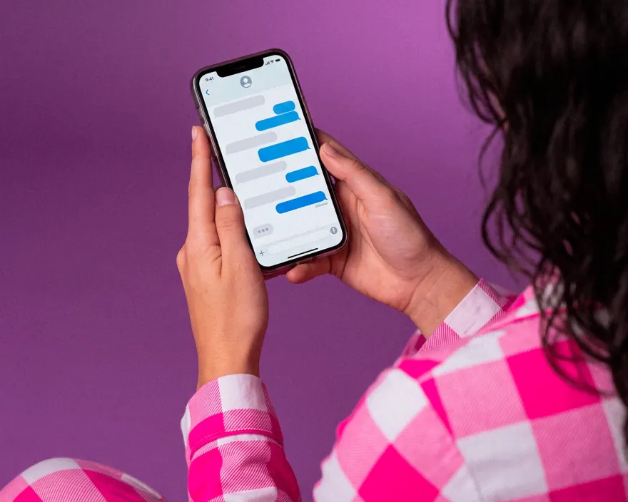 Creator chatting with the community on her phone
